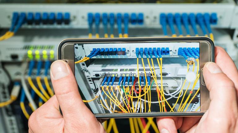 male-hands-photographed-internet-router-with-wires-connectors